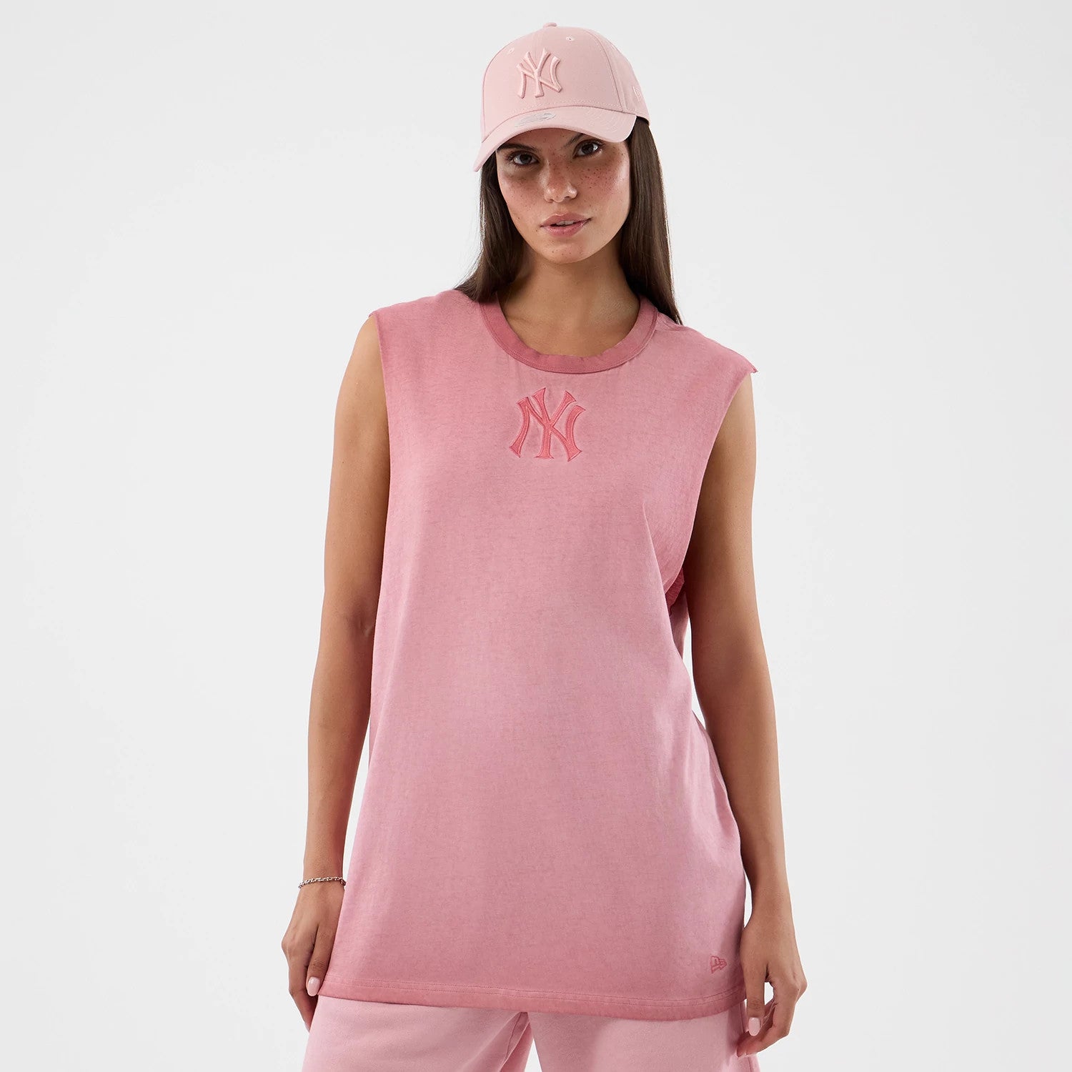 The model is wearing this MLB Washed Logo New York Yankees Vest in pastel pink. 4
