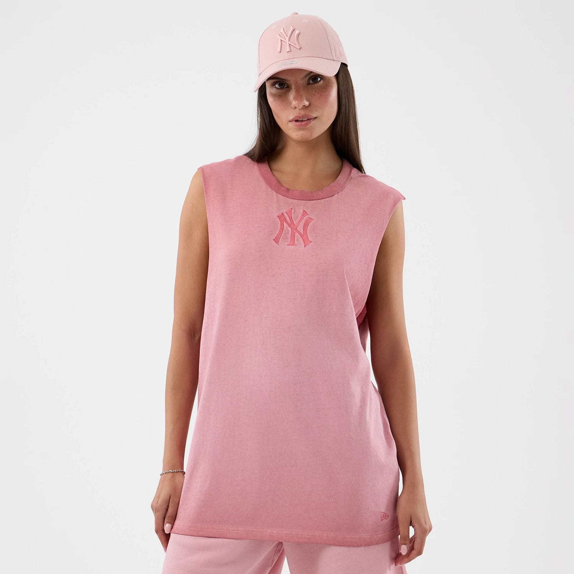 The model is wearing this MLB Washed Logo New York Yankees Vest in pastel pink. 4