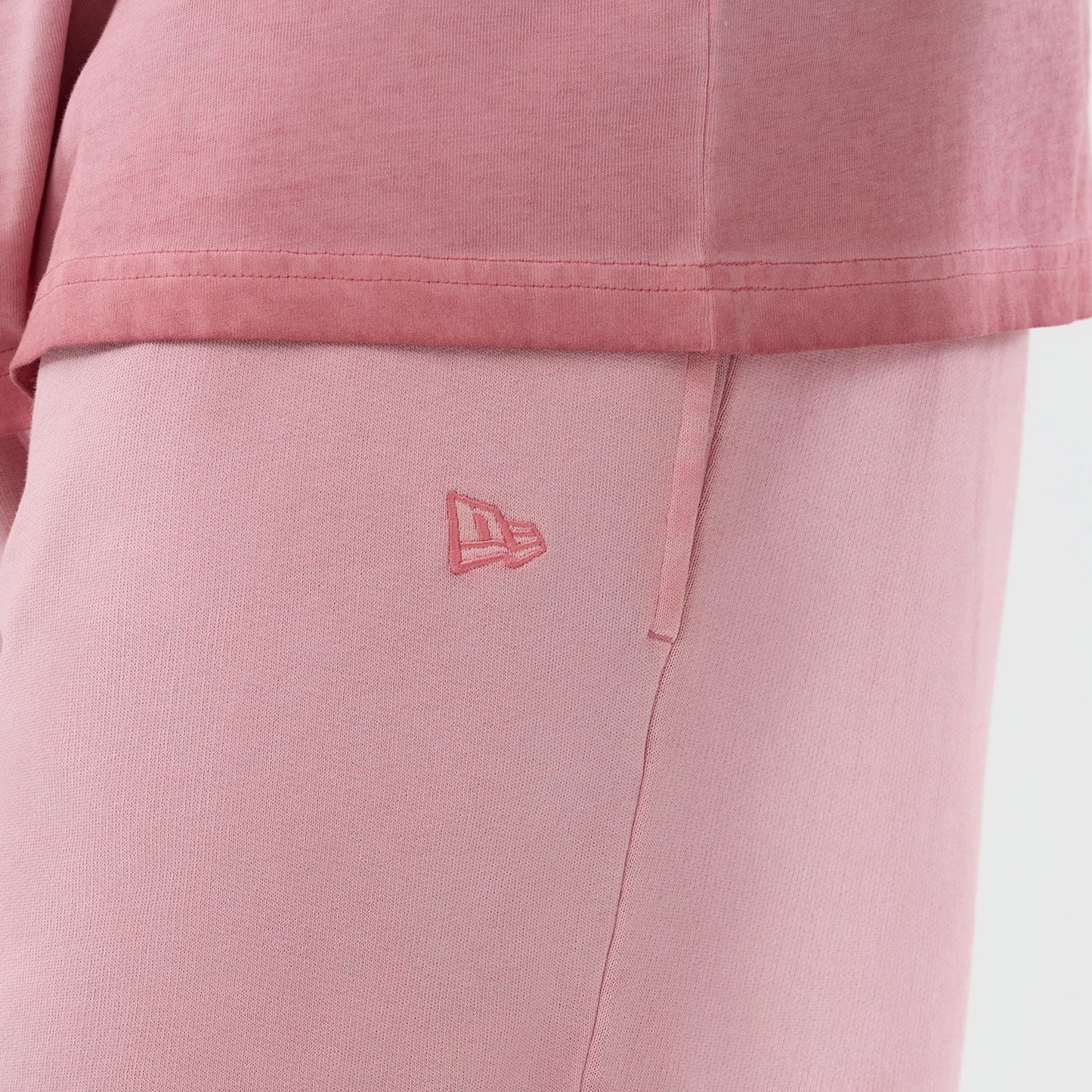 The model is wearing this MLB Washed Logo New York Yankees Shorts in pastel pink. 4