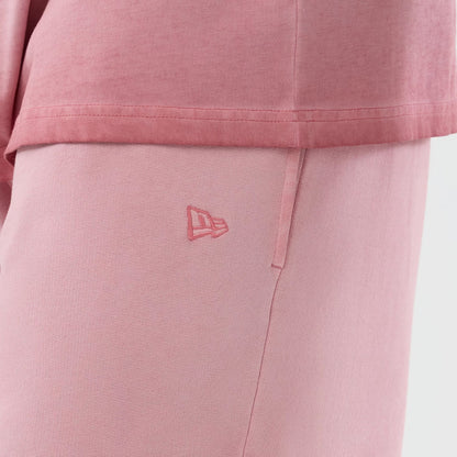 The model is wearing this MLB Washed Logo New York Yankees Shorts in pastel pink. 4