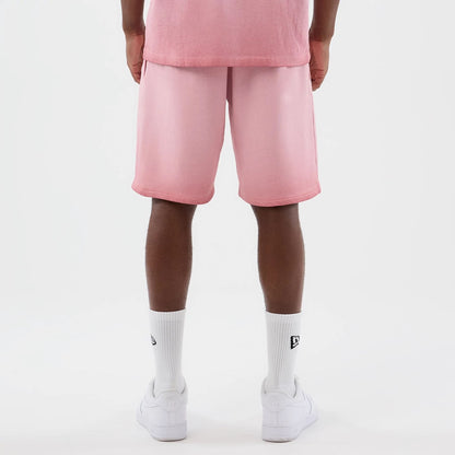 The model is wearing this MLB Washed Logo New York Yankees Shorts in pastel pink. 2