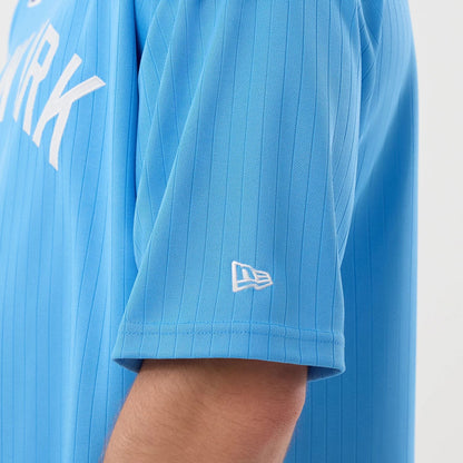 The model is wearing this MLB Arch New York Yankees Oversized T-Shirt in pastel blue. 5