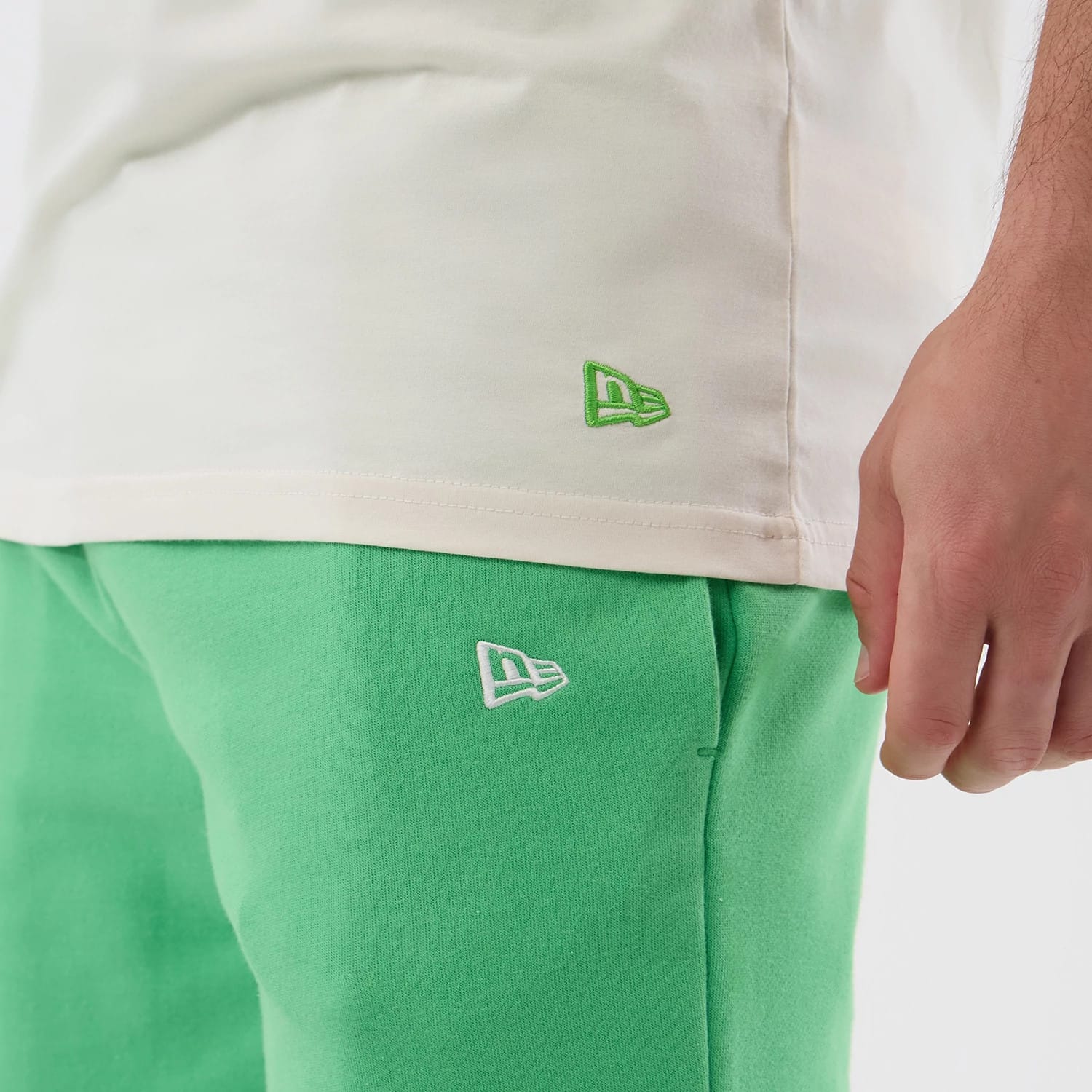 The model is wearing this MLB League Essential LA Dodgers Shorts in open green. 5