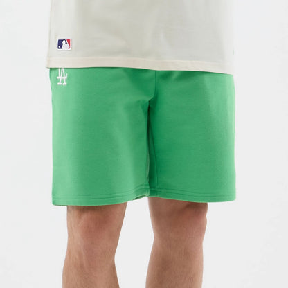 The model is wearing this MLB League Essential LA Dodgers Shorts in open green. 6