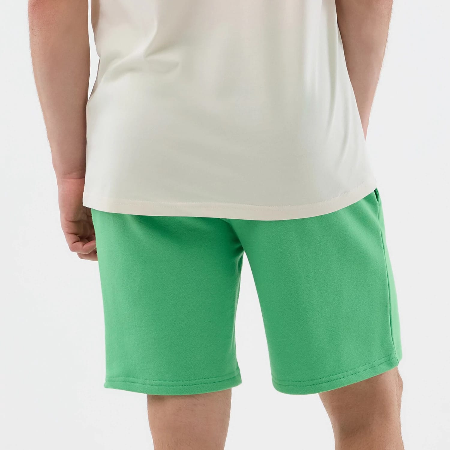 The model is wearing this MLB League Essential LA Dodgers Shorts in open green. 7