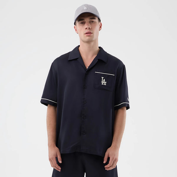 The model is wearing this MLB Graphic Revere LA Dodgers Short Sleeve Shirt in navy. 1