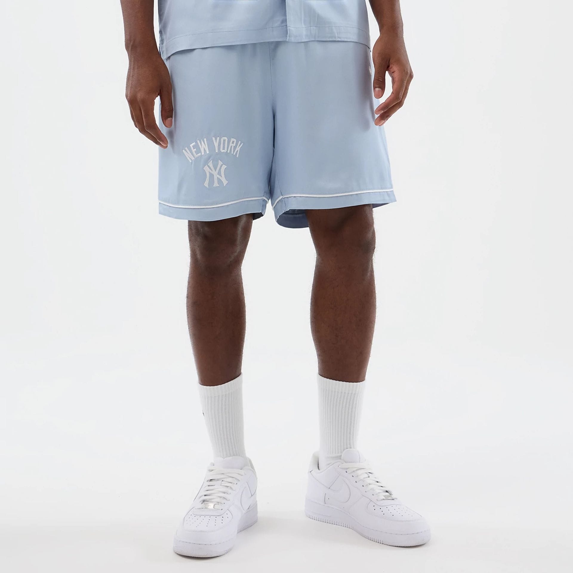 The model is wearing this MLB Woven New York Yankees Shorts in pastel blue. 1