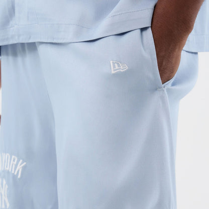 The model is wearing this MLB Woven New York Yankees Shorts in pastel blue. 5