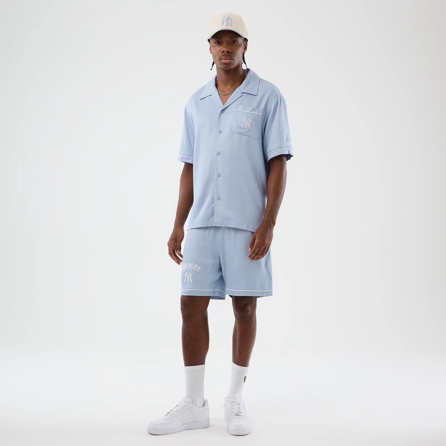 The model is wearing this MLB Woven New York Yankees Shorts in pastel blue. 8