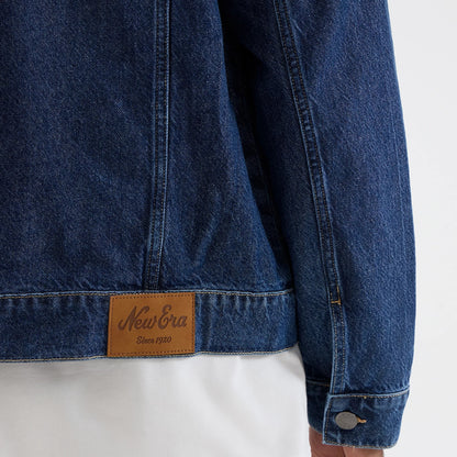 The model is wearing this New Era Script Denim Jacket in dark blue. 6