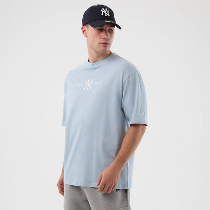 The model is wearing this MLB Script New York Yankees Oversized T-Shirt in pastel blue. 3