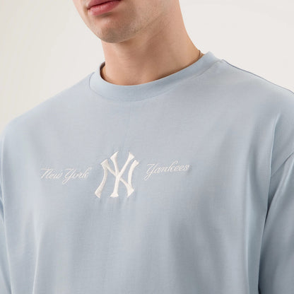 The model is wearing this MLB Script New York Yankees Oversized T-Shirt in pastel blue. 6