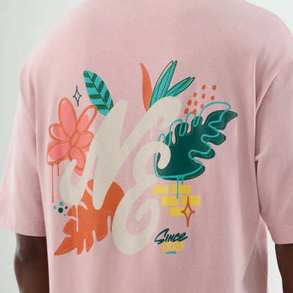 The model is wearing this New Era Floral Graphic Oversized T-Shirt in pastel pink. 8