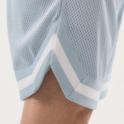 The model is wearing this New Era Mesh Oversized Shorts in pastel blue. 6