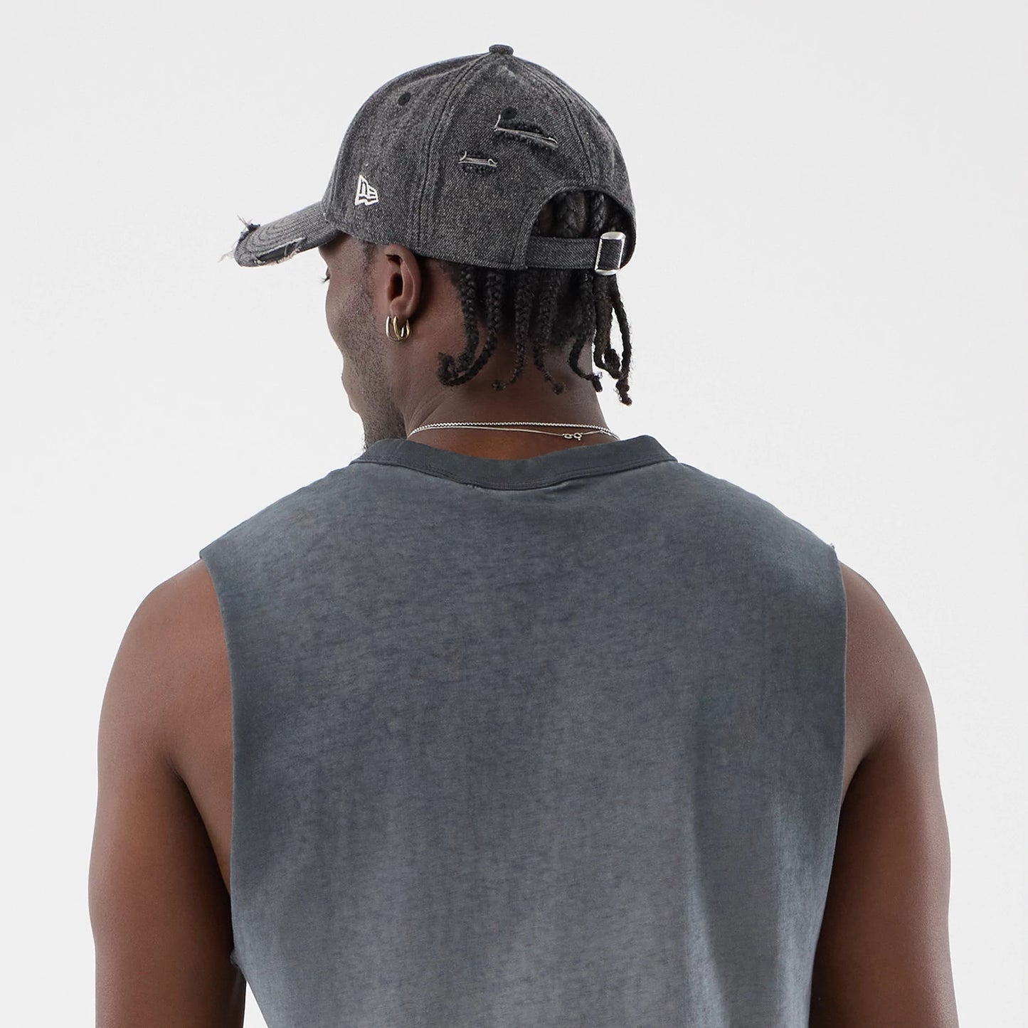 The model is wearing this MLB Washed Logo New York Yankees Vest in black. 7