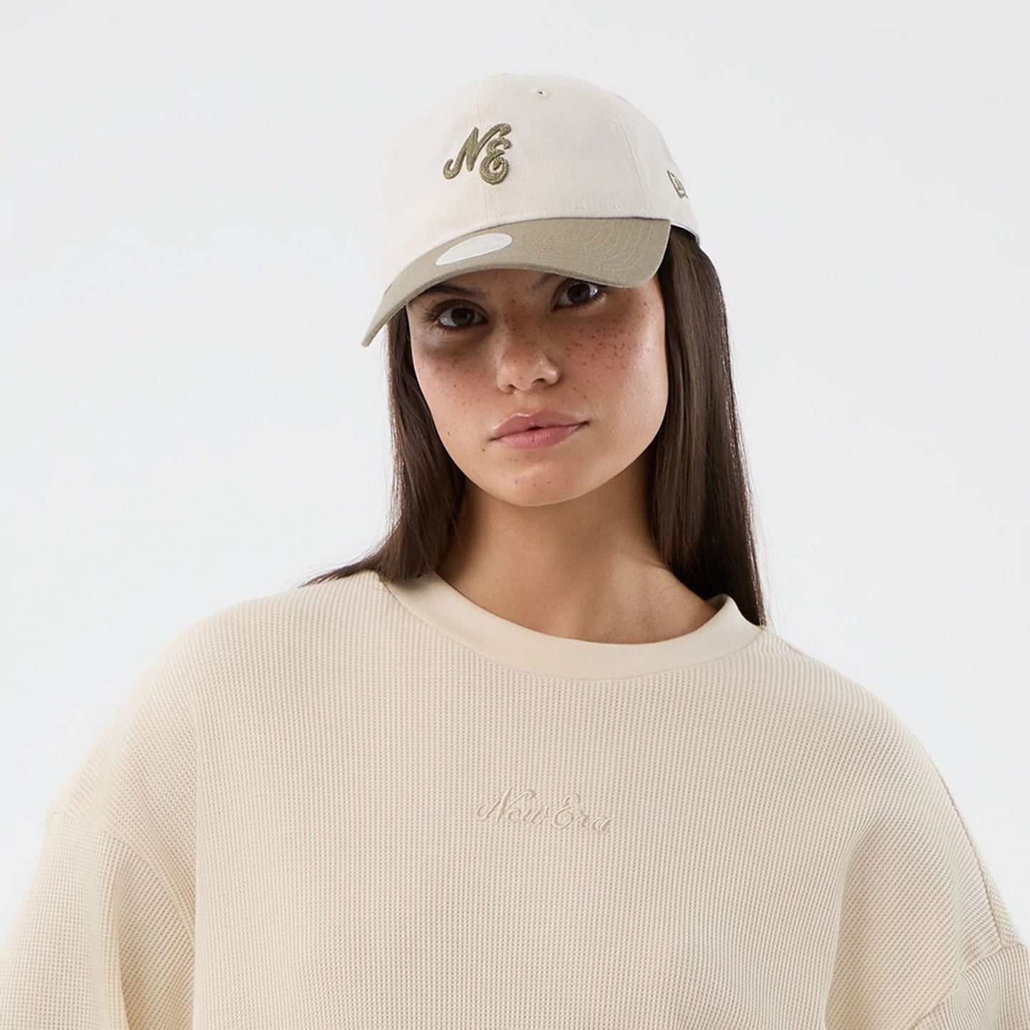 The model is wearing this New Era Waffle T-Shirt in light beige. 6