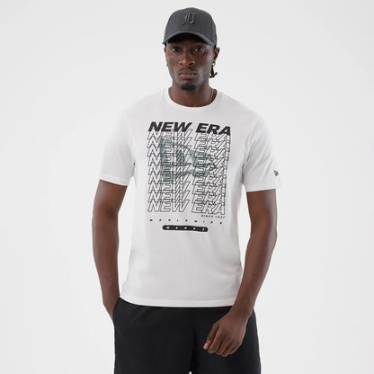 The model is wearing this New Era Logo Graphic T-Shirt in white. 1