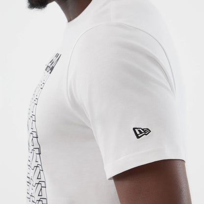 The model is wearing this New Era Logo Graphic T-Shirt in white. 5