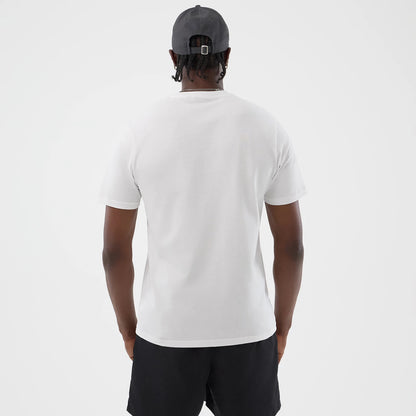 The model is wearing this New Era Logo Graphic T-Shirt in white. 2