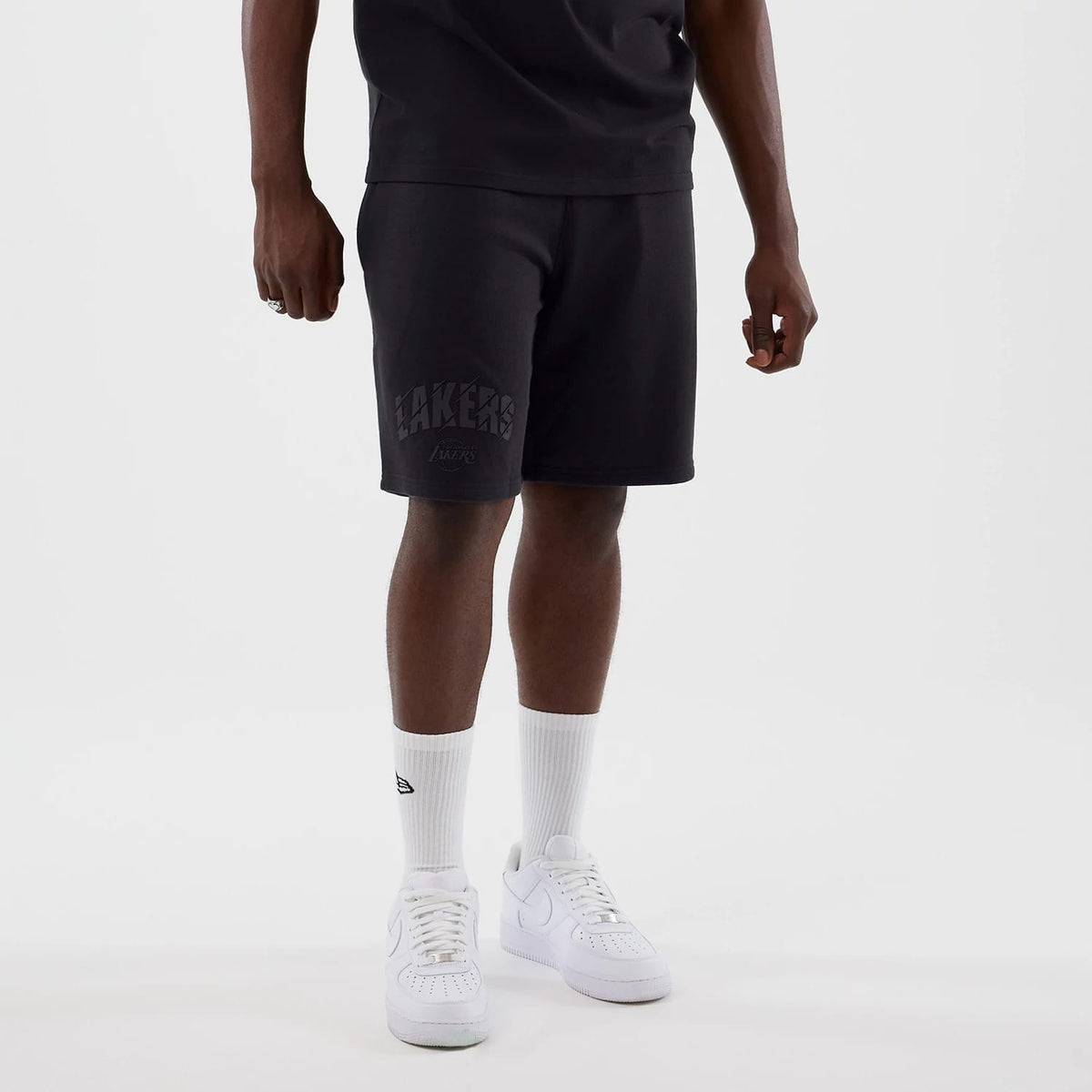 The model is wearing this NBA Core Plus LA Lakers Shorts in navy. 7