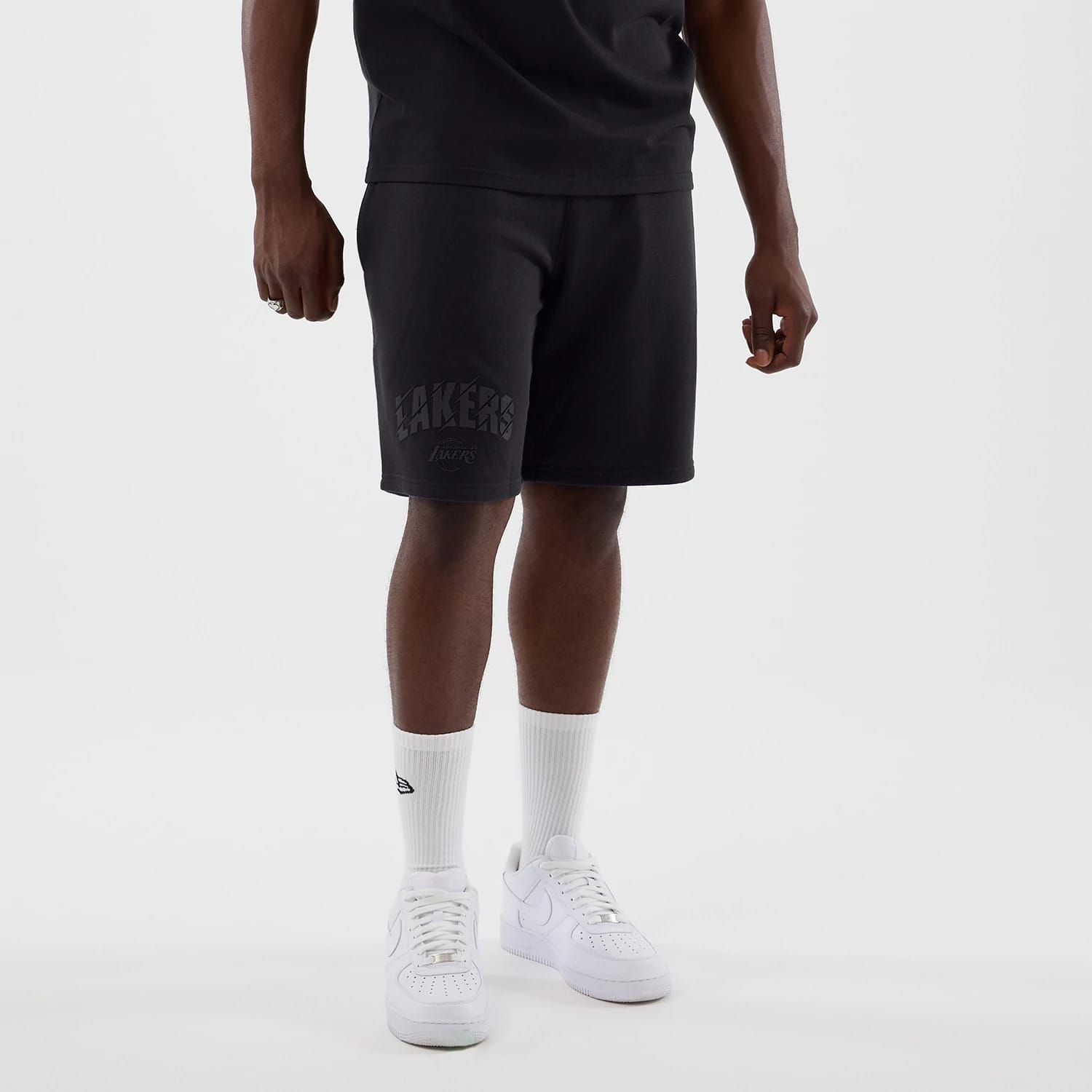 The model is wearing this NBA Core Plus LA Lakers Shorts in navy. 7