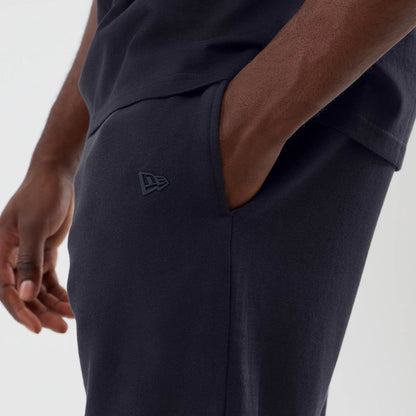 The model is wearing this NBA Core Plus LA Lakers Shorts in navy. 4