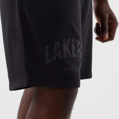 The model is wearing this NBA Core Plus LA Lakers Shorts in navy. 5