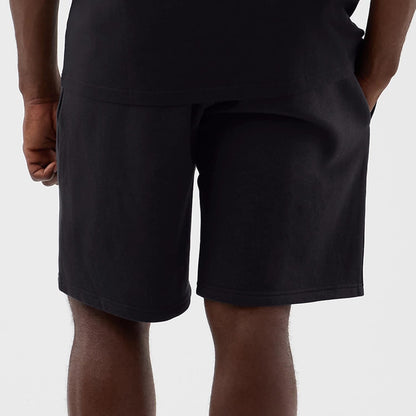 The model is wearing this NBA Core Plus LA Lakers Shorts in navy. 6