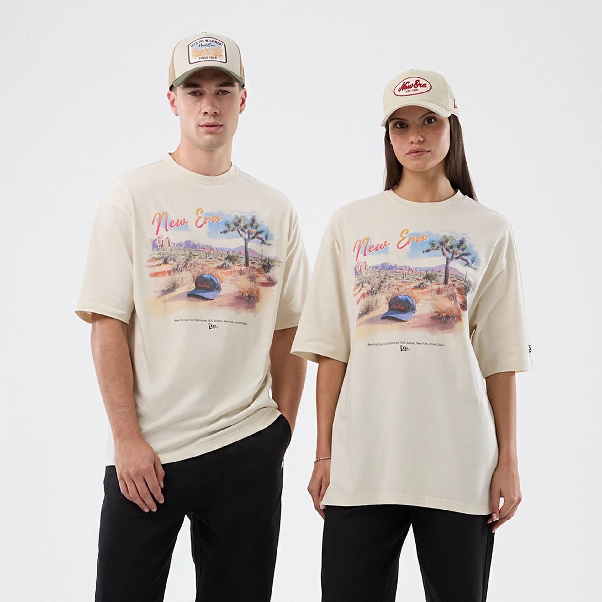 The model is wearing this New Era Dessert Graphic Oversized T-Shirt in light beige. 1