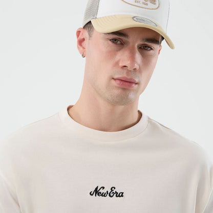 The model is wearing this New Era Floral Graphic Oversized T-Shirt in open white. 6