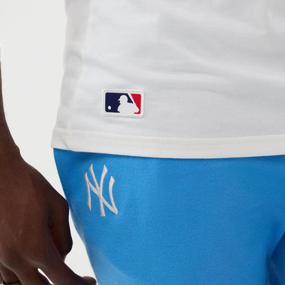 The model is wearing this MLB League Essential New York Yankees Vest in white. 6