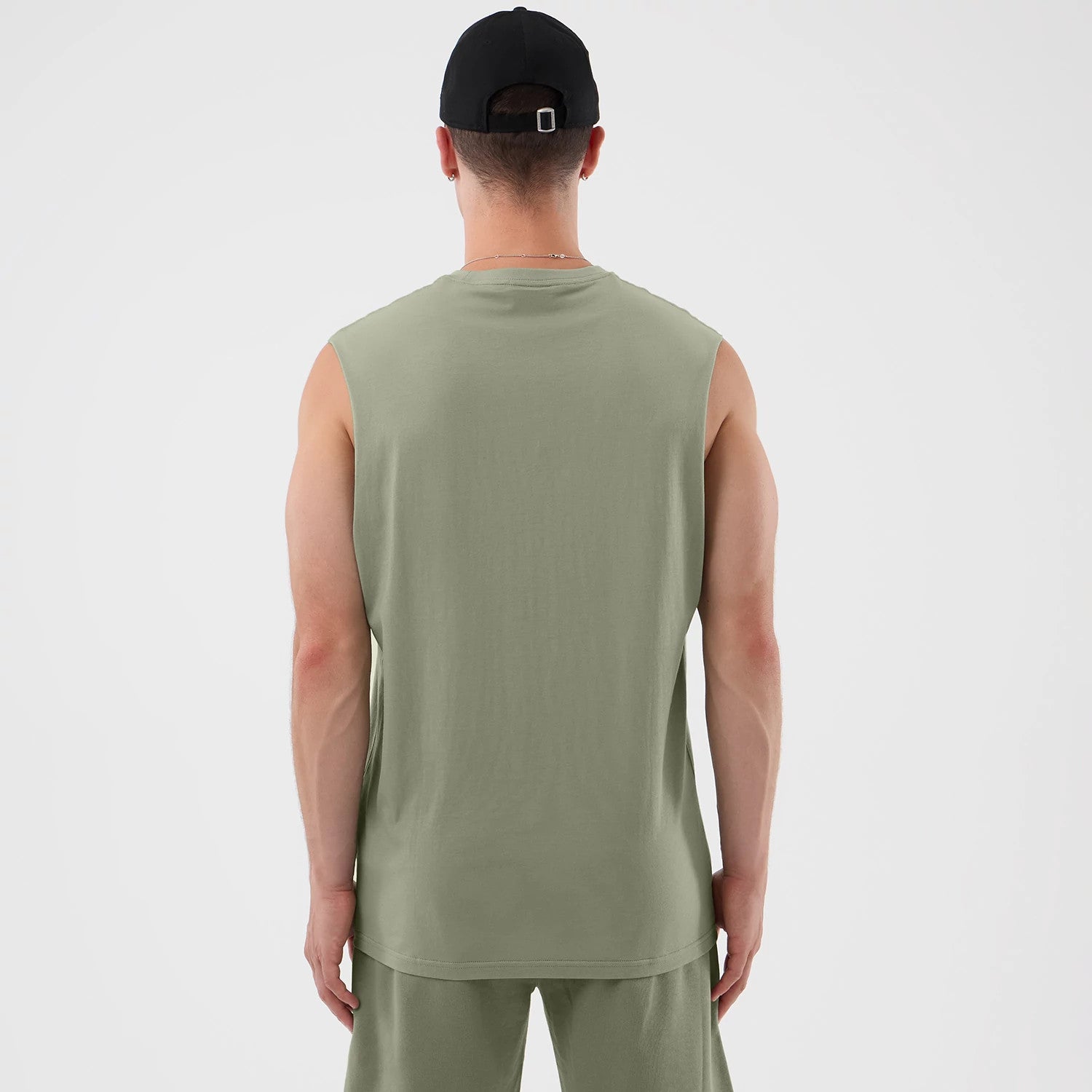 The model is wearing this NBA League Essential Chicago Bulls Vest in pastel green. 2