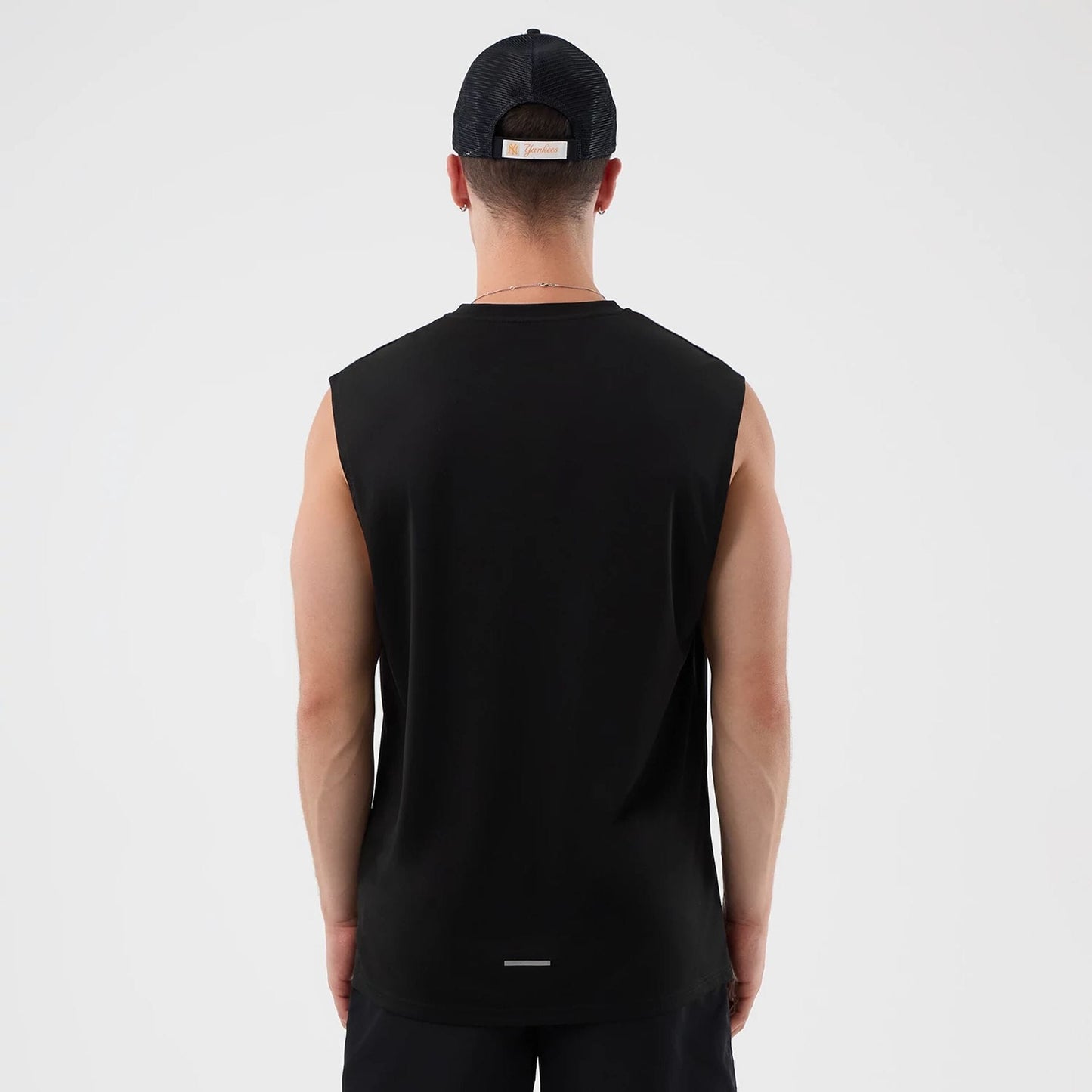 The model is wearing this MLB Core Plus New York Yankees Vest in black. 2