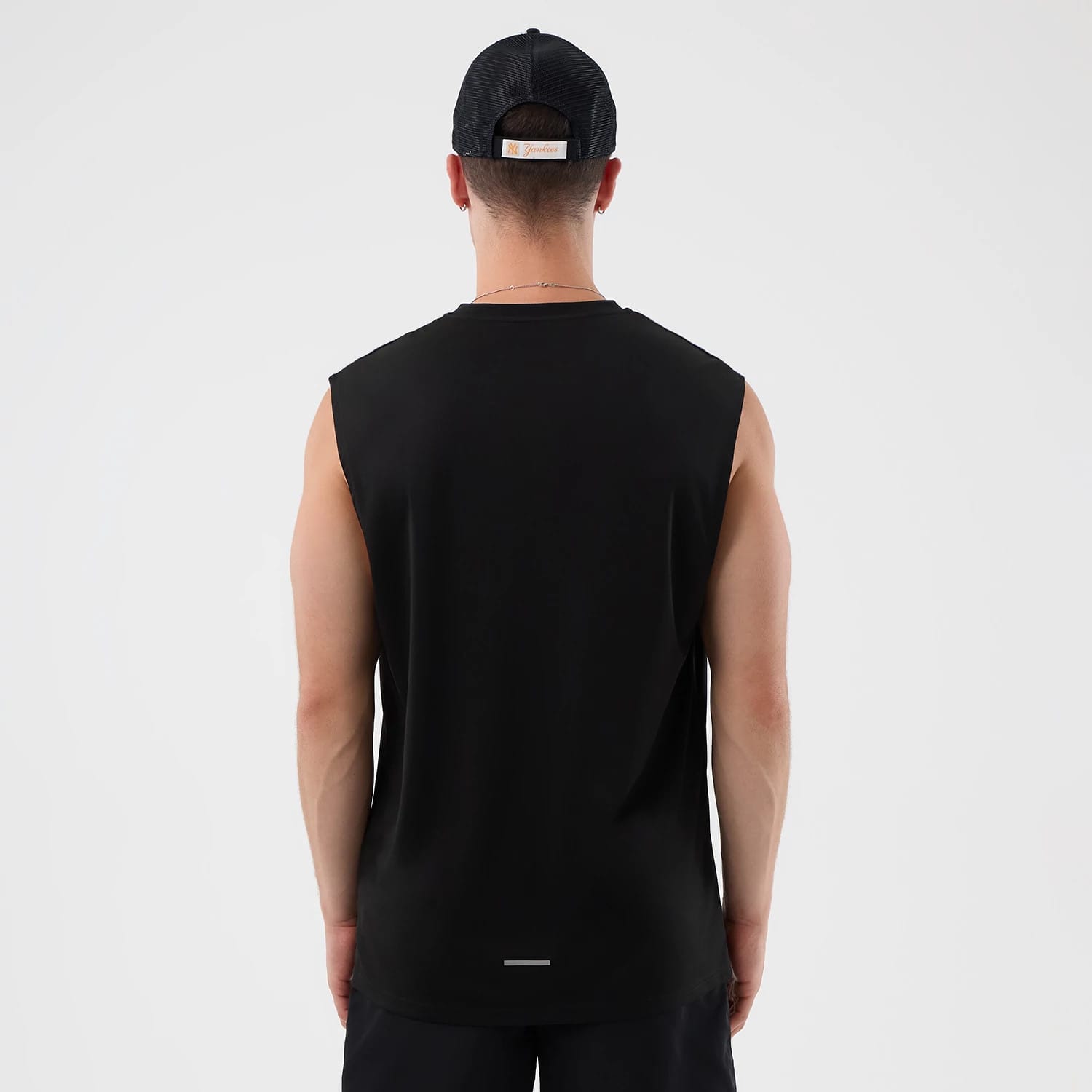 The model is wearing this MLB Core Plus New York Yankees Vest in black. 2