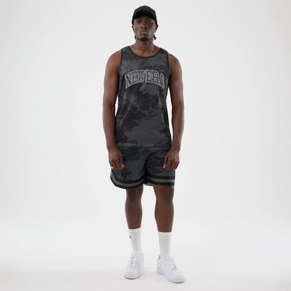 The model is wearing this New Era All Over Print Mesh Tank Top in black camo. 8