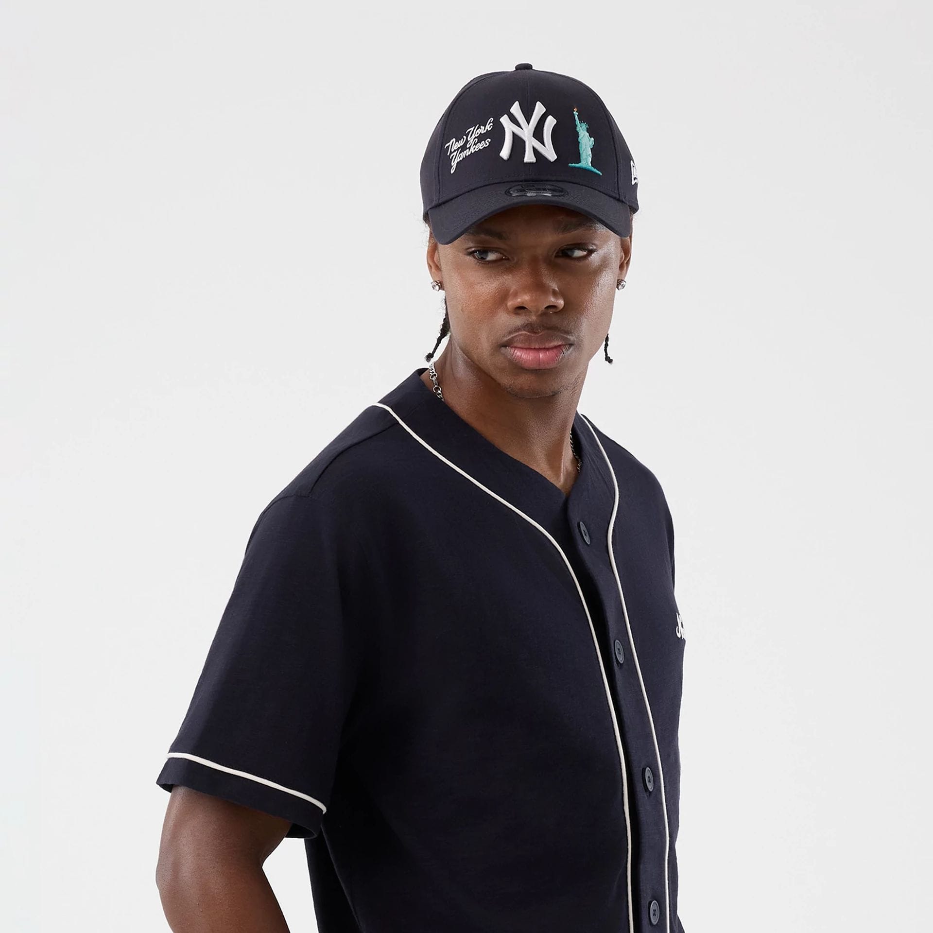 The model is wearing this New Era Slub Baseball Jersey in navy. 6