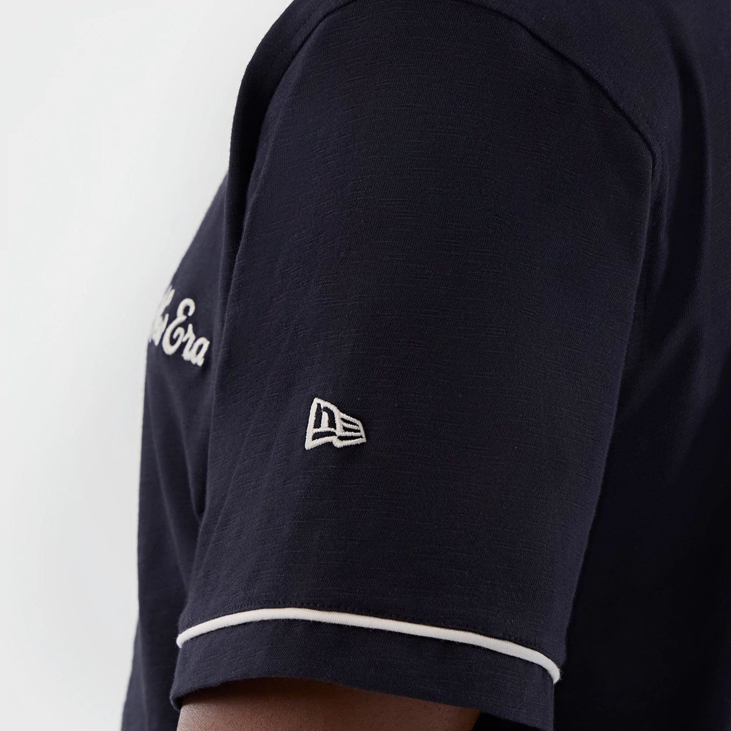 The model is wearing this New Era Slub Baseball Jersey in navy. 7