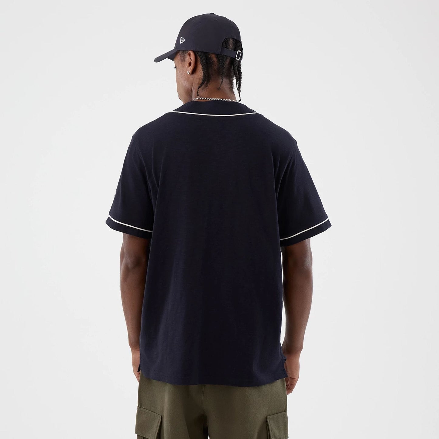 The model is wearing this New Era Slub Baseball Jersey in navy. 2