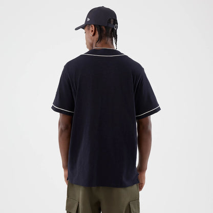 The model is wearing this New Era Slub Baseball Jersey in navy. 2