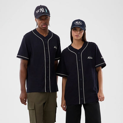The model is wearing this New Era Slub Baseball Jersey in navy. 1