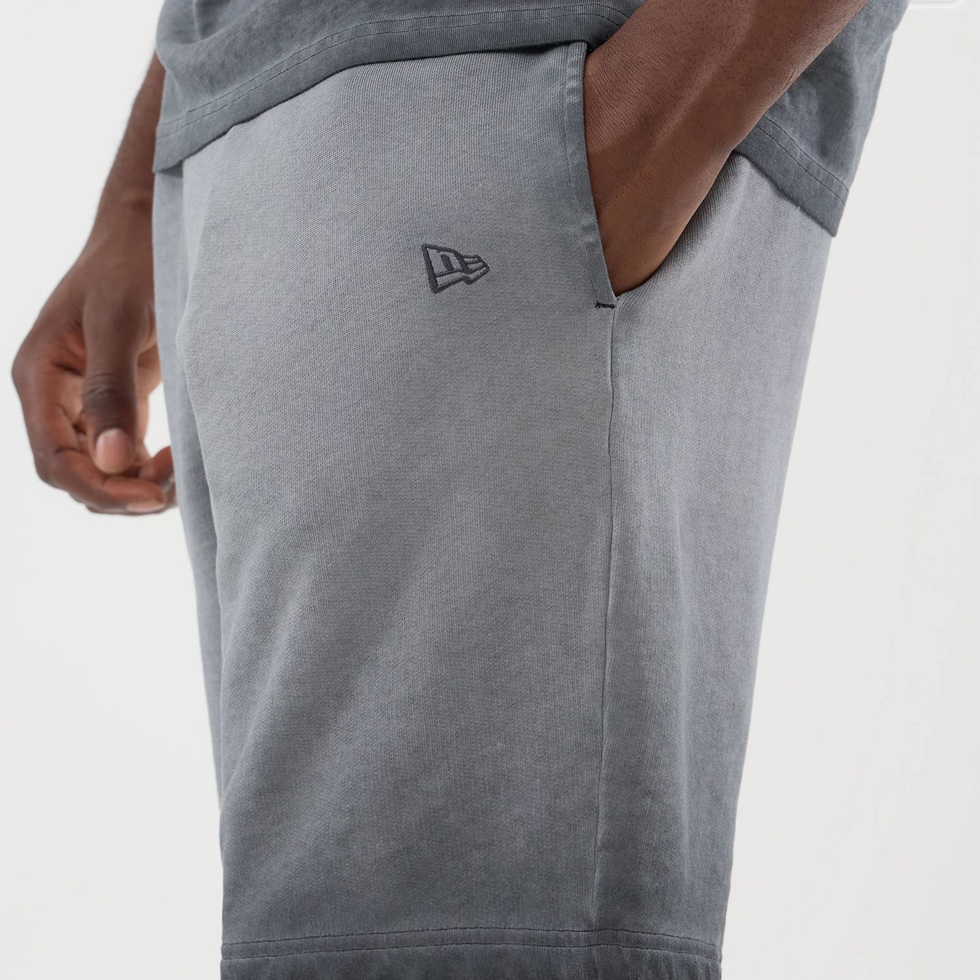 The model is wearing this MLB Washed Logo New York Yankees Shorts in black. 4