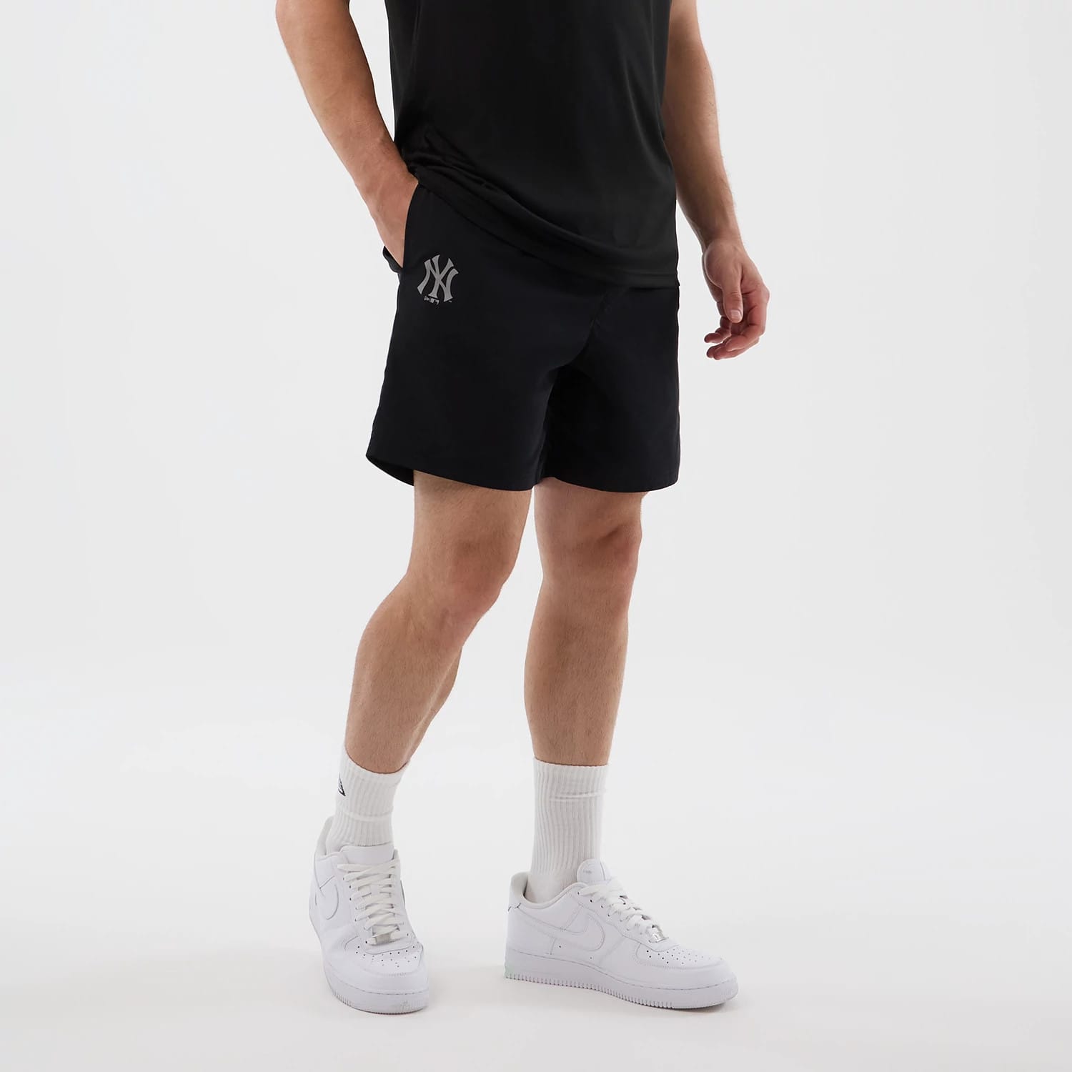 The model is wearing this MLB Core Plus New York Yankees Shorts in black. 7