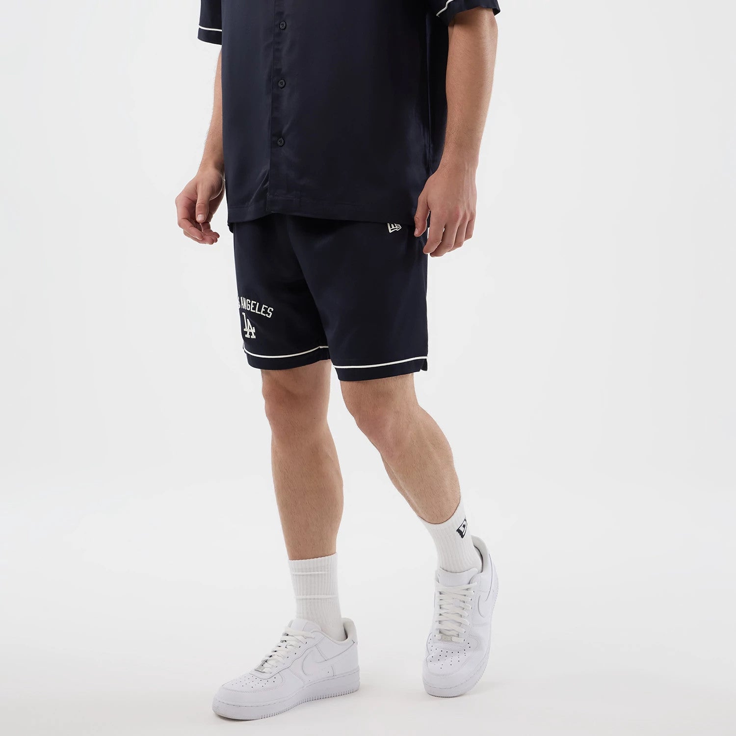 The model is wearing this MLB Woven LA Dodgers Shorts in navy. 3