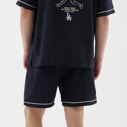 The model is wearing this MLB Woven LA Dodgers Shorts in navy. 7