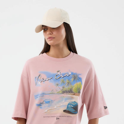 The model is wearing this New Era Beach Graphic Oversized T-Shirt in pastel pink. 6