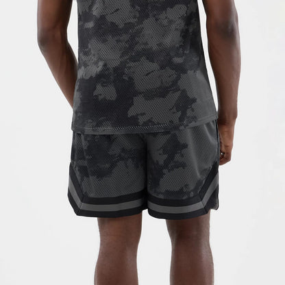 The model is wearing this New Era All Over Print Mesh Shorts in black camo. 6