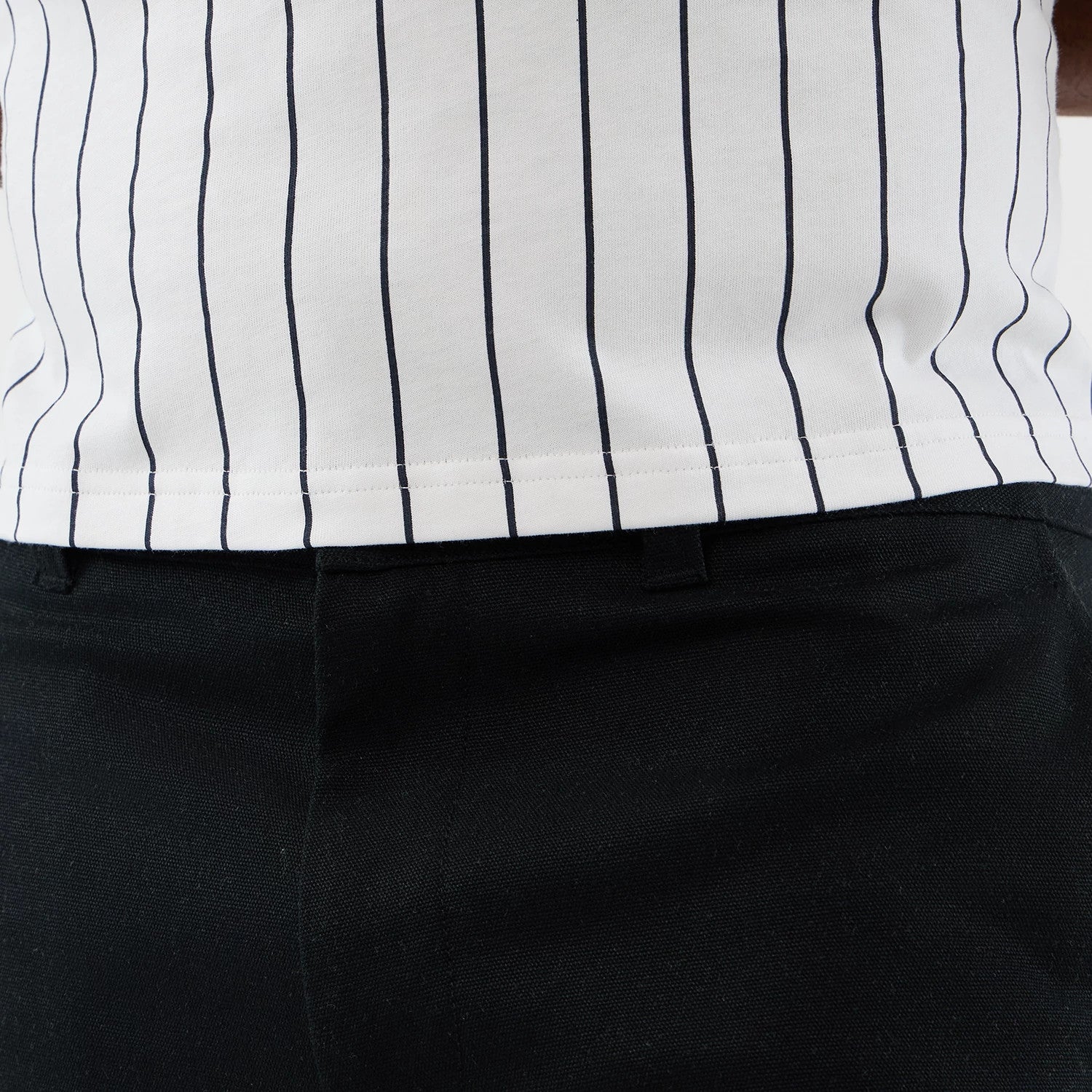 The model is wearing this New Era Cargo Shorts in black. 4
