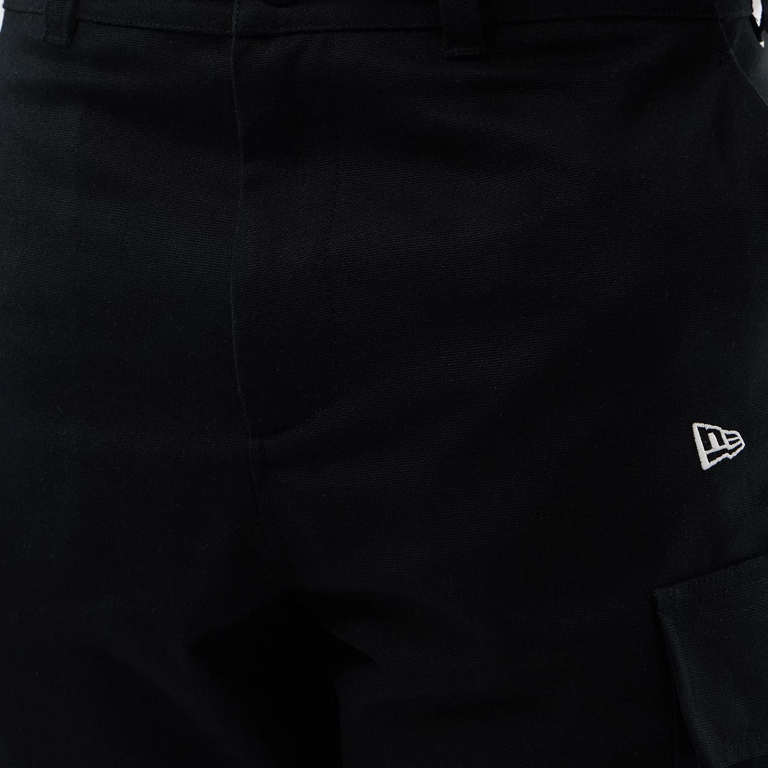 The model is wearing this New Era Cargo Shorts in black. 6