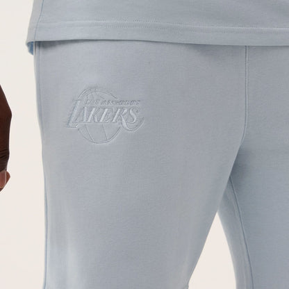 The model is wearing this NBA League Essential LA Lakers Shorts in pastel blue. 3