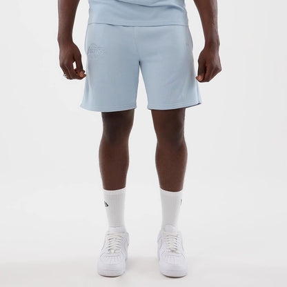 The model is wearing this NBA League Essential LA Lakers Shorts in pastel blue. 1